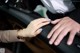 A woman's hand with a blue manicure on her nails.