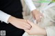 A man and a woman holding hands during a wedding ceremony.